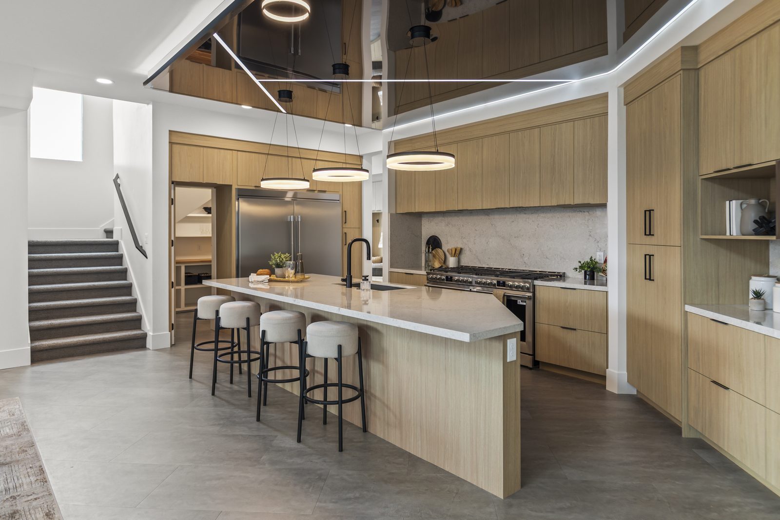 Chef's kitchen with oversized island in Draper home — Ensign Custom Homes