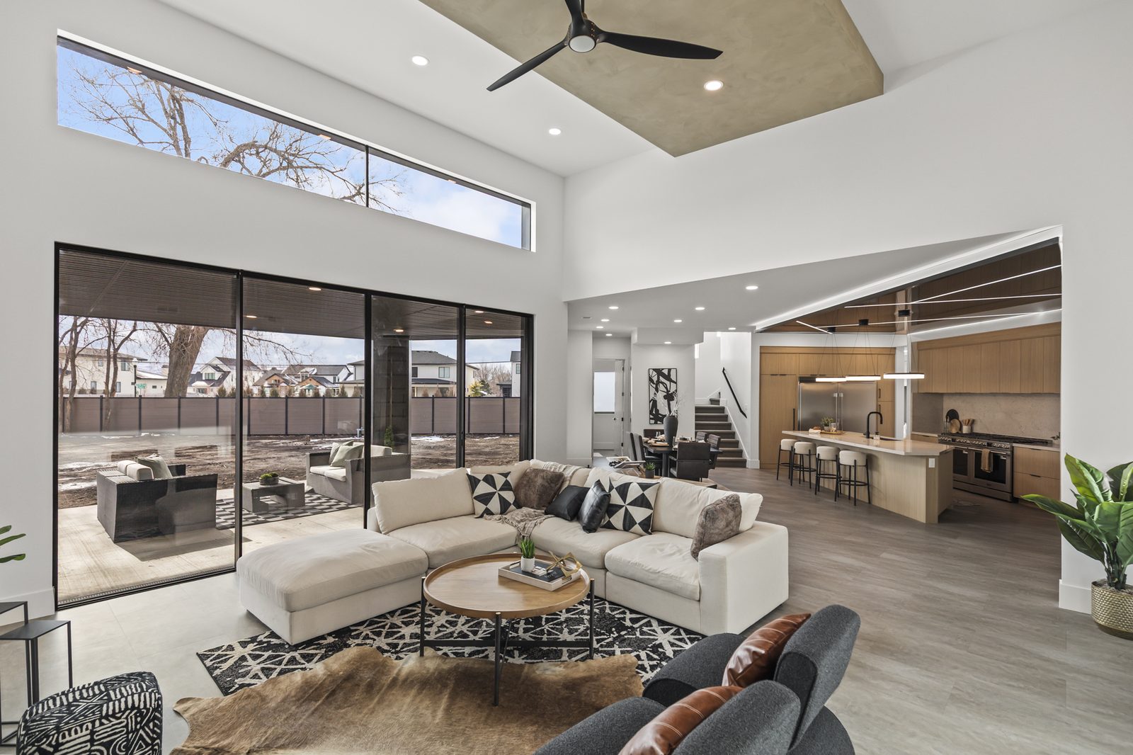 Modern open-concept living room in custom home — Ensign Custom Homes Draper Utah